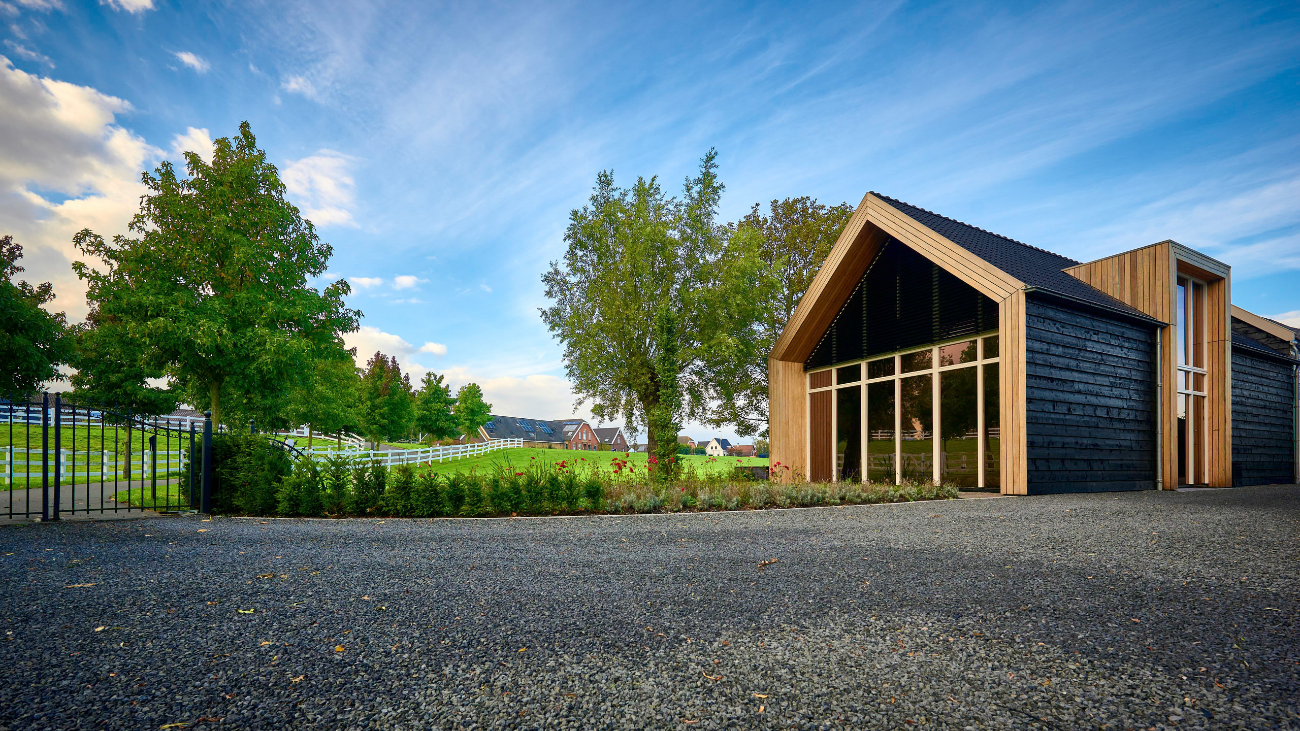Contemporary timber-clad building in a green rural setting